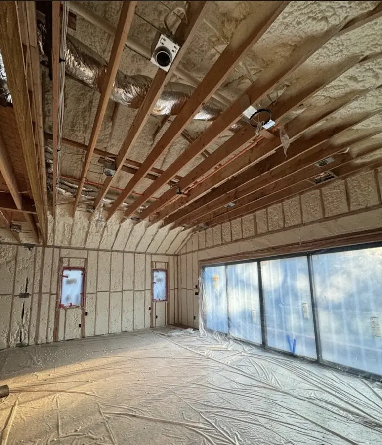 Interior walls and ceiling insulated with spray foam during new construction in Buxton